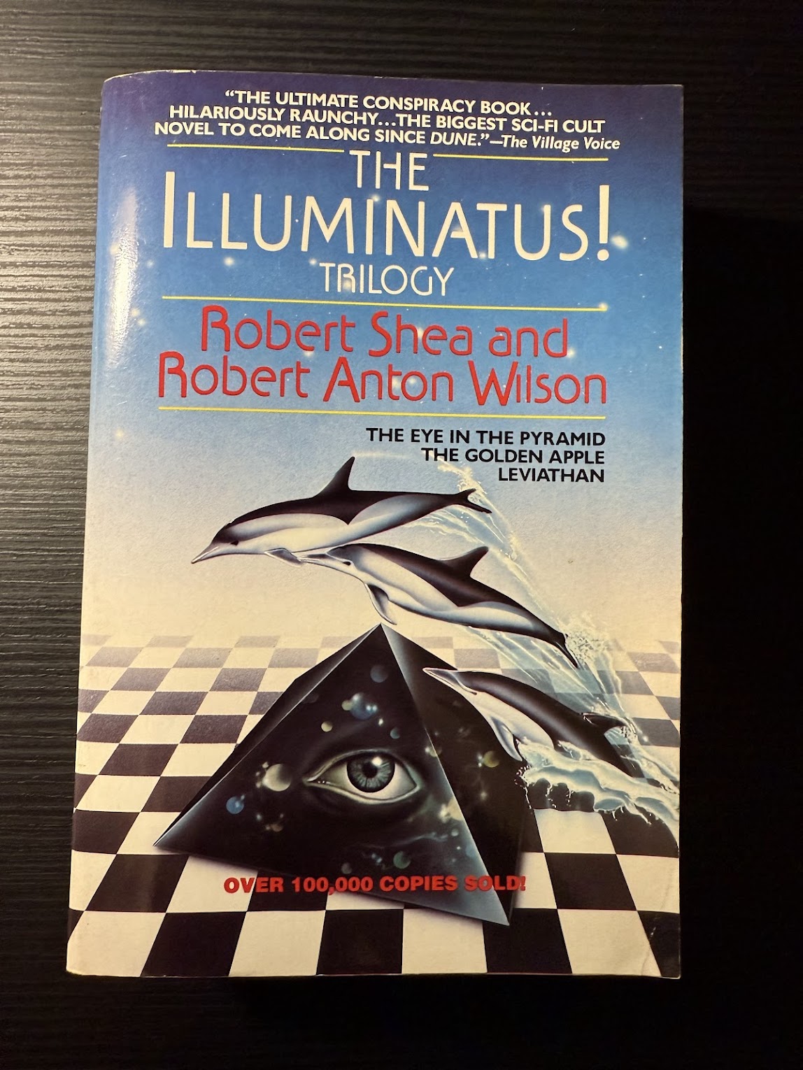 The Illuminatus Trilogy by Robert Shea and Robert Anton Wilson
