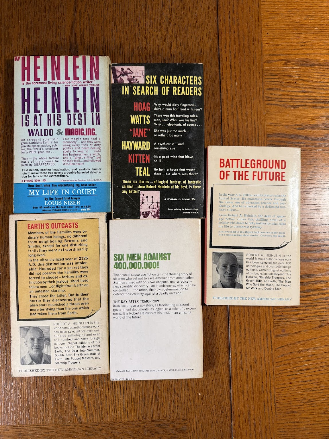 5 vintage paperbacks by Robert Heinlein