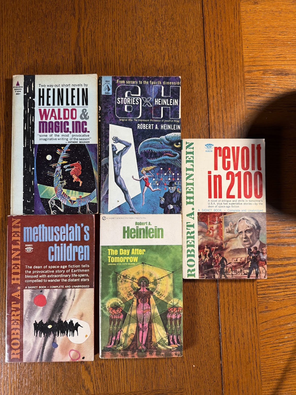 5 vintage paperbacks by Robert Heinlein