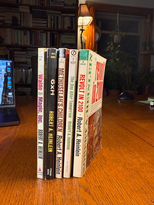 5 vintage paperbacks by Robert Heinlein